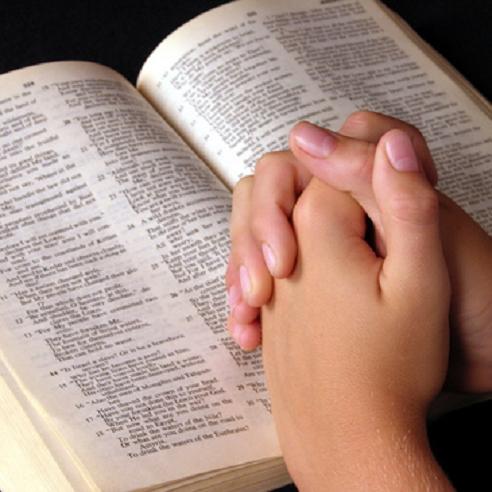 praying over bible[1]